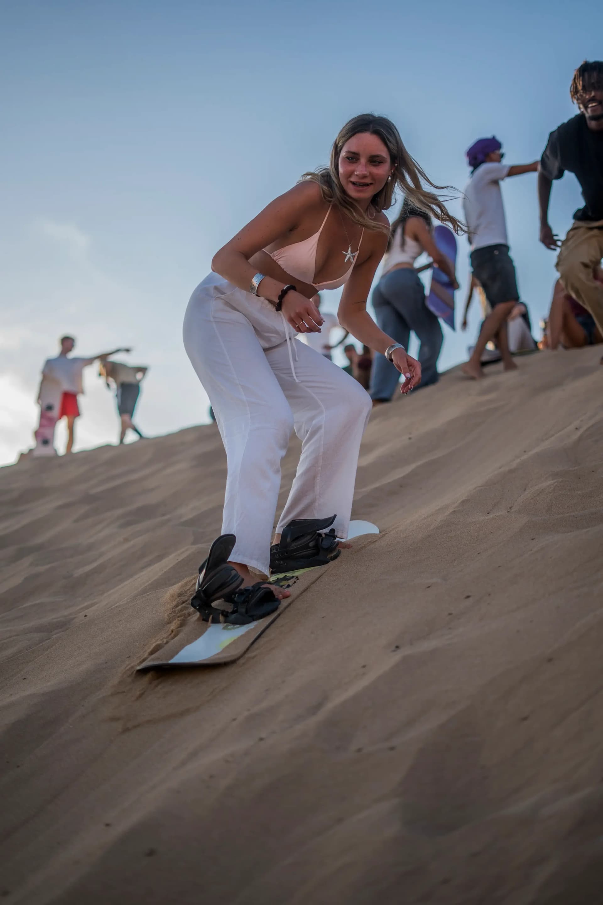girl sand boarding in Imsouane