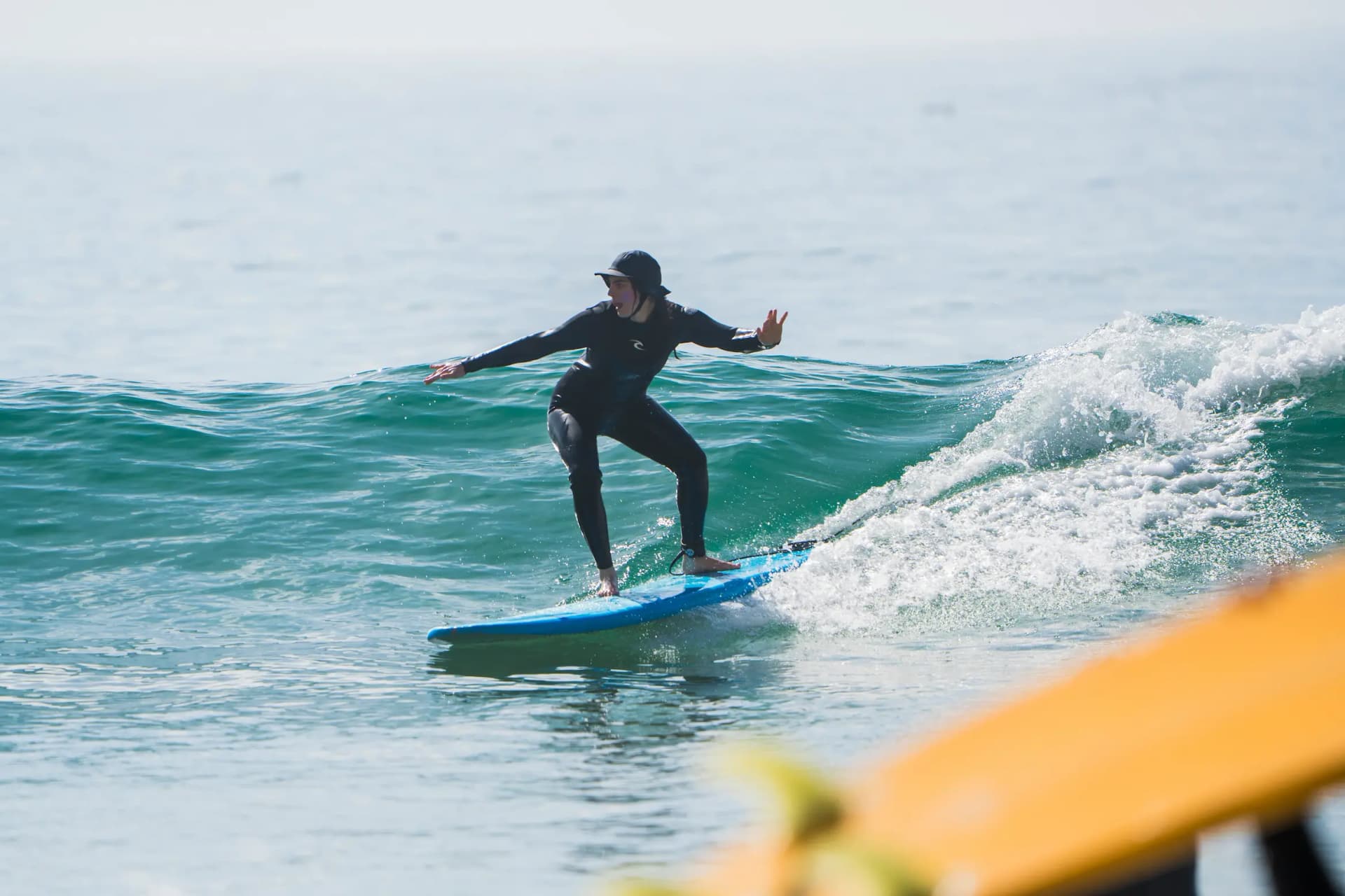 Surfer walking to the ocean